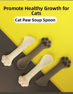 Detail of paw-shaped silicone pet food spoons with scraping edges for cat cans