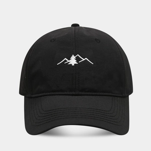 Close-up of white mountain embroidery on black quick-dry outdoor baseball cap