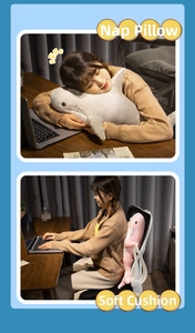 Pink and grey plush shark pillows used as soft nap cushions and office chair backrests