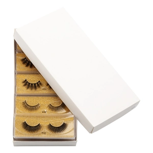Detailed view of 3D mink false eyelashes models #100, #101, #107 in gold glitter trays