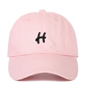 Close-up of pink baseball cap featuring 3D black H letter embroidery and twill cotton fabric