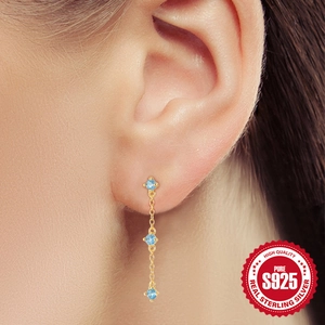 Elegant S925 sterling silver drop earrings with light blue gems and long gold chain tassels