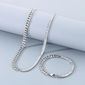 Detailed shot of silver titanium steel necklace and bracelet set with cubic zirconia stones