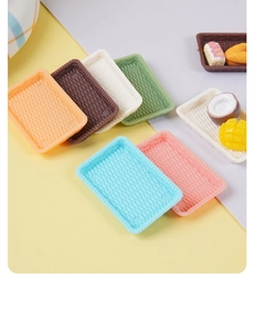 Detailed view of rectangular miniature rattan-style trays in six assorted pastel colors