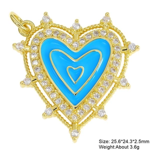 Detailed macro of gold heart pendant with blue enamel, white zircon, and dimensions
