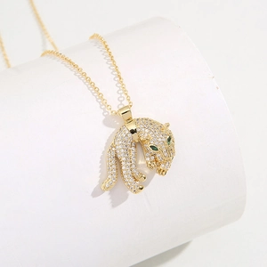 18K gold plated brass leopard necklace with clear zircons and green crystal eyes