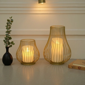 European luxury golden iron candle holder set with elegant hollow wire design for decor
