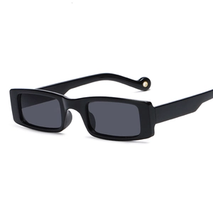 Retro black rectangular sunglasses with narrow frame and metallic temple details