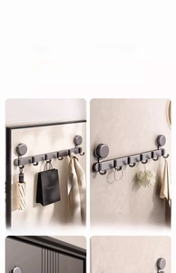 Détail du support mural à ventouse gris foncé avec 6 crochets pour salle de bain