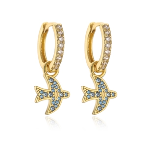 Detailed close-up of 18K gold earrings featuring zircon inlay and a colorful bird charm