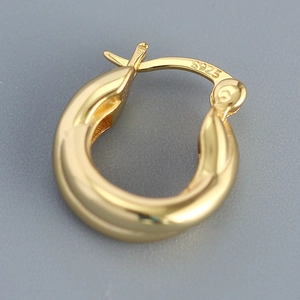 Minimalist gold S925 sterling silver crossover hoop earring with a polished finish