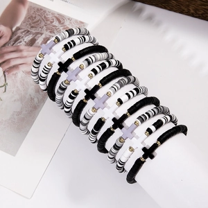 Detail of bohemian multilayer polymer clay cross bracelets with elastic beads