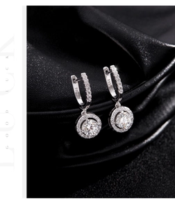 Macro shot of S925 sterling silver halo earrings with zircon on black silk background