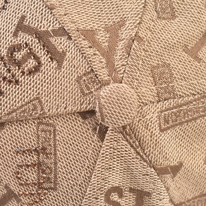 Detailed macro view of checkered canvas fabric with rhinestone YS embroidery on baseball cap