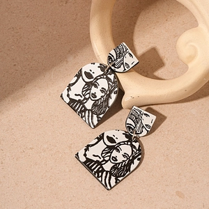 Artistic acrylic geometric earrings featuring black and white female line art portraits