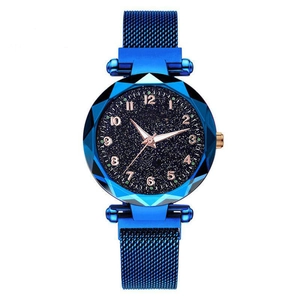 Detail of starry blue dial with rose gold numerals and magnetic milanese watch strap
