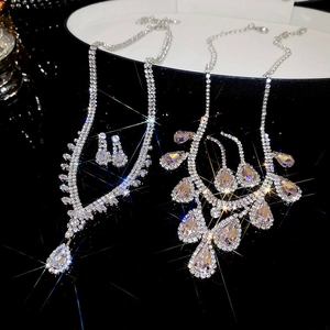 Luxurious silver jewelry set with pear-cut cubic zirconia necklace and stud earrings