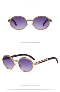 Close-up of retro round sunglasses with colorful rhinestones and purple gradient lenses