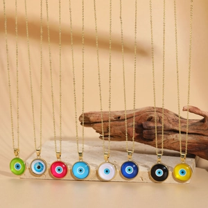 Macro display of colorful enamel evil eye pendants on gold chains in eight vibrant colors