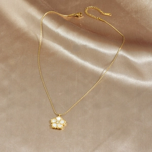 Gold plated stainless steel necklace with white mother of pearl flower pendant and diamond