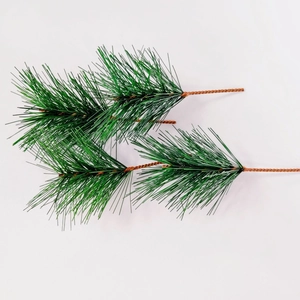 Green artificial pine needle branches for Christmas wreaths and DIY home decor