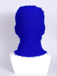 Detail shot of blue knitted balaclava showing soft plush texture and premium warm yarn
