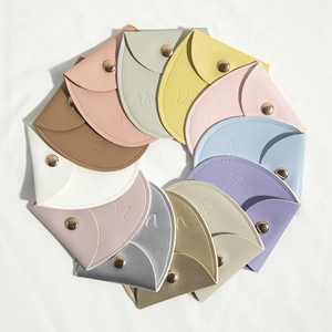 Various colorful PU leather jewelry pouches with gold snap buttons in a circular layout