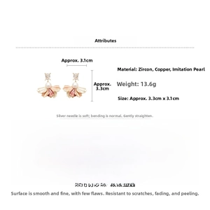 Detail view of flower petal earrings with cubic zirconia, imitation pearl and silver needles