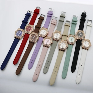 Collection of ten colorful women's quartz watches with diamond encrusted horseshoe cases