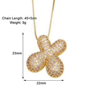 Detail view of gold flower pendant necklace with dimensions and full clear zircon inlay
