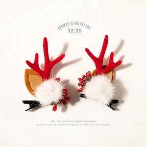 Christmas reindeer antler hair clips with red berries and white plush balls for holiday decor