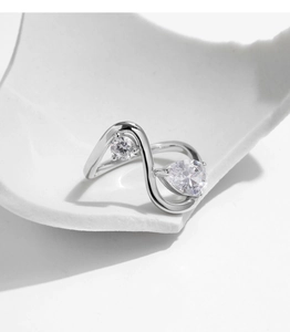 Detailed shot of an S925 sterling silver ring with irregular lines and sparkling crystals