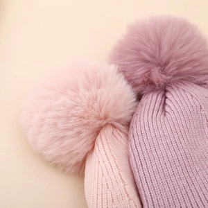 Winter knit hat set for girls with warm pom-poms and jacquard heart pattern in pink and purple