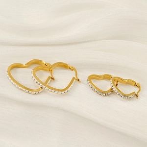 18k gold plated stainless steel heart earrings with crystals on white silk background