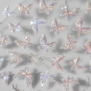 Macro shot of iridescent laser butterfly nail art stickers with translucent shell effect