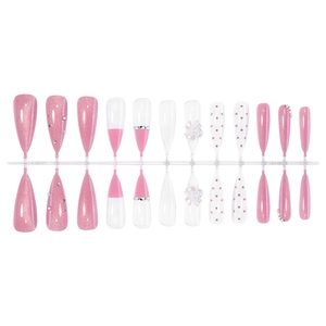 Long stiletto press-on nails with pink glitter, 3D bows, and rhinestone accents