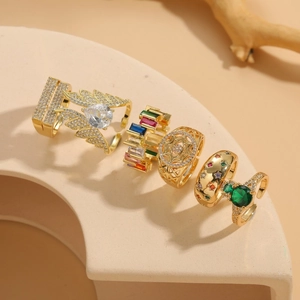 Set of 6 vintage gold-plated rings featuring colorful crystals and bohemian designs