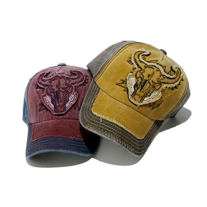 Vintage washed cotton baseball caps with bull skull patch and distressed details