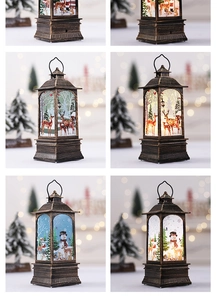 Detail view of retro bronze Christmas lanterns with reindeer and snowman LED light effects