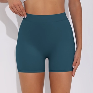Detailed close-up of high-waisted seamless teal yoga shorts showing wide waistband and fit