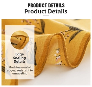 Detailed view of yellow floral silk scarf with durable machine-stitched edge seams