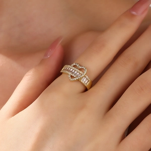 18k gold plated heart-shaped open ring featuring clear zircon stones on model's finger