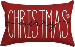Detail of red linen Christmas pillow cover with white snowflake and merry text