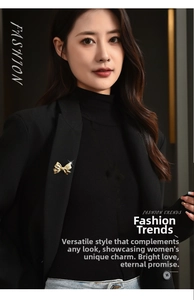 Detail of a golden bow brooch with a brushed metal texture pinned on a black suit lapel