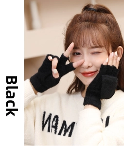 Detail of black fingerless knitted gloves with a flip top cover for women