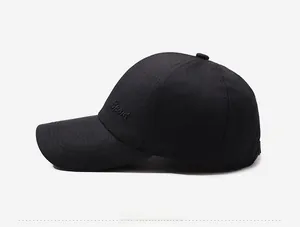 Detail view of black cotton baseball cap with Sport embroidery and classic curved brim