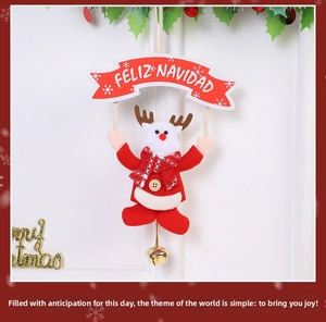 Plush reindeer Christmas ornament with Feliz Navidad banner and golden bell detail