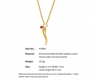Detail of gold horn pendant necklace with red rose enamel and sparkling zircons