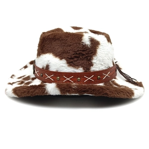 Detail of western cow print fedora featuring brown leather band and metallic studs