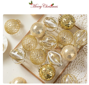 Detailed view of luxury gold and clear Christmas ornaments with glitter on wooden tray